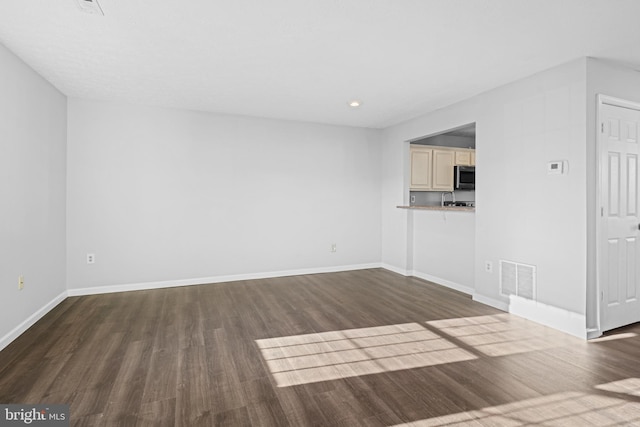 unfurnished living room featuring hardwood / wood-style floors