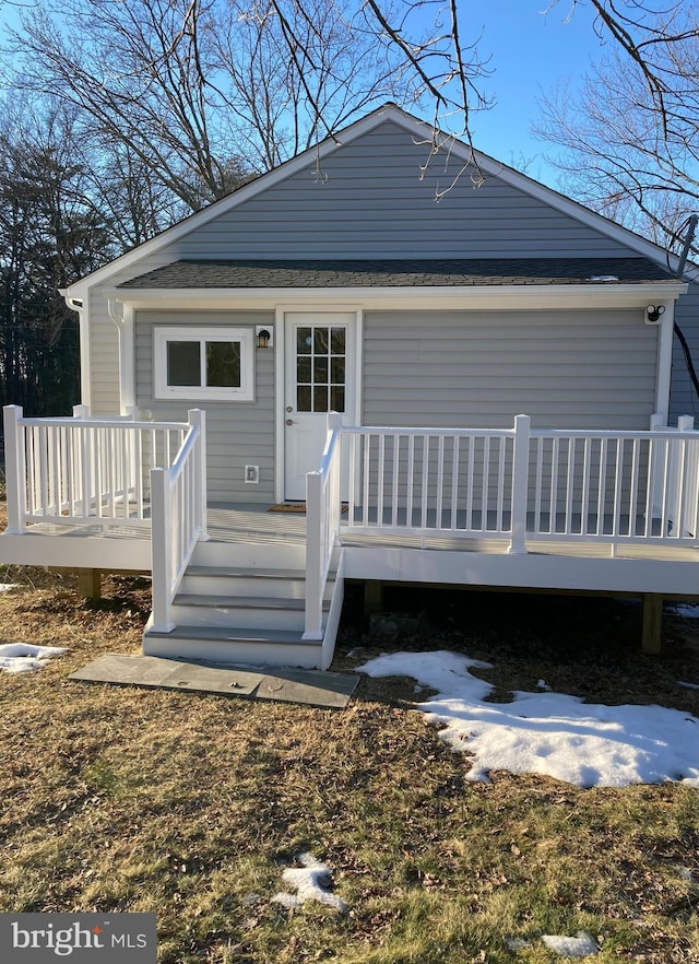 back of house with a wooden deck