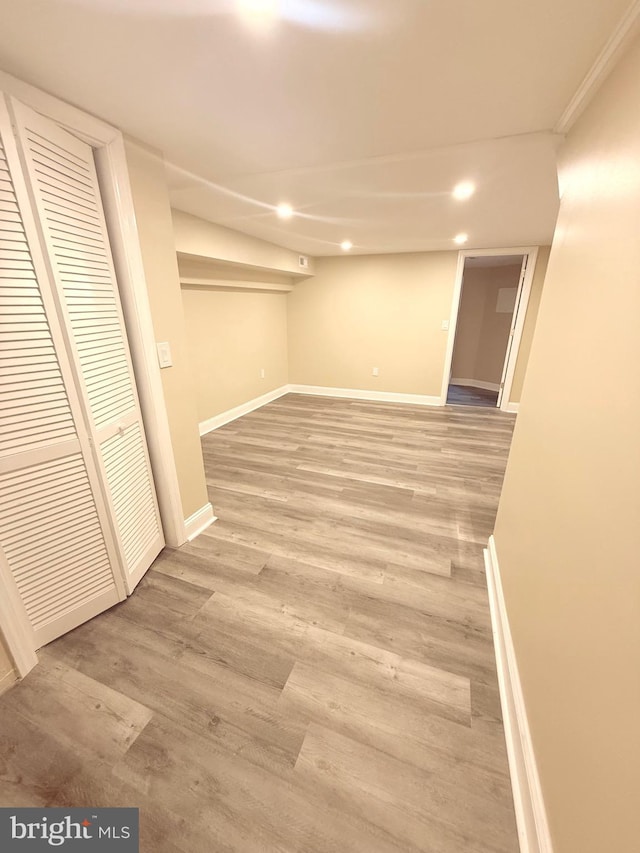 basement with hardwood / wood-style flooring