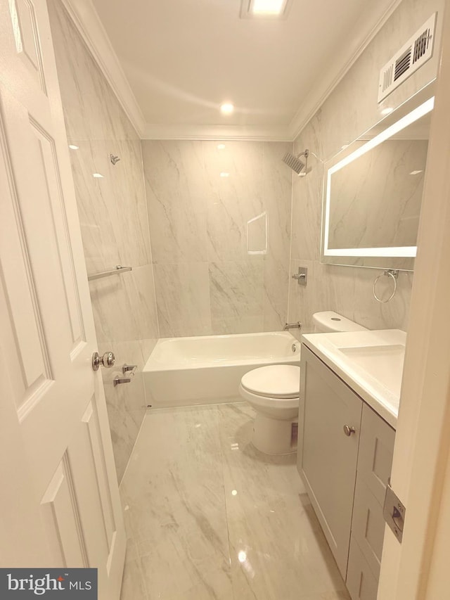 full bathroom with toilet, tiled shower / bath, tile walls, crown molding, and vanity