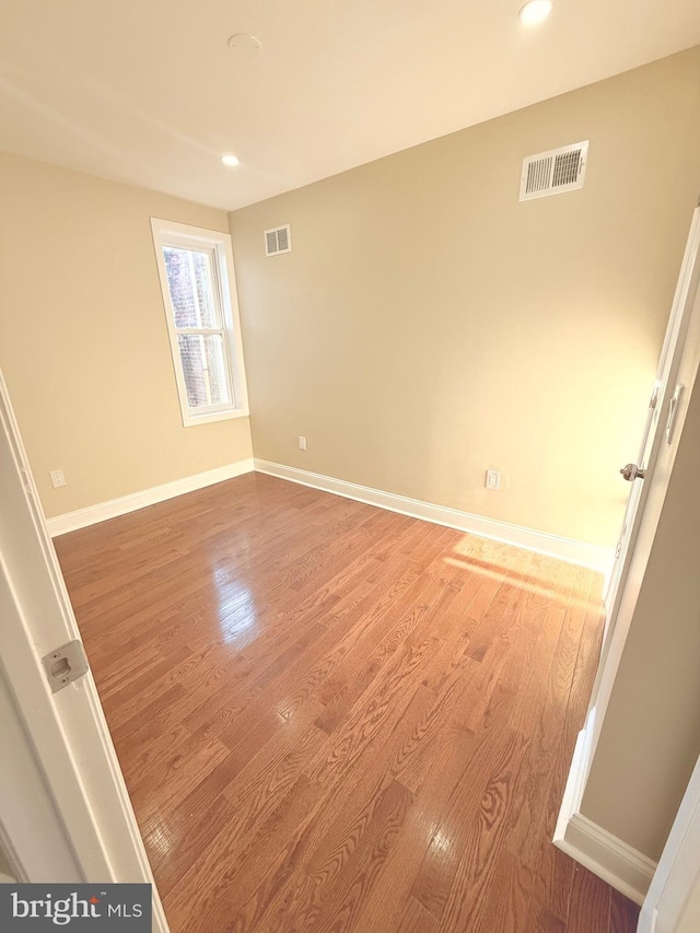 empty room featuring hardwood / wood-style floors