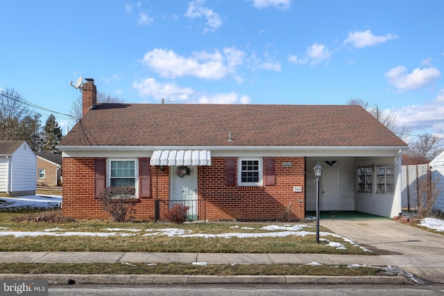 view of front of property with a carport