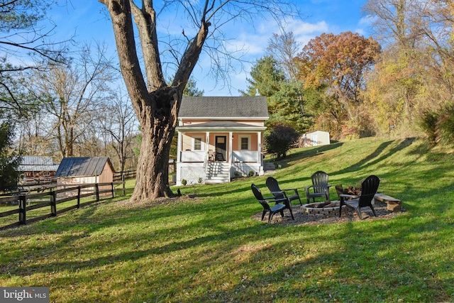 view of yard with an outdoor fire pit