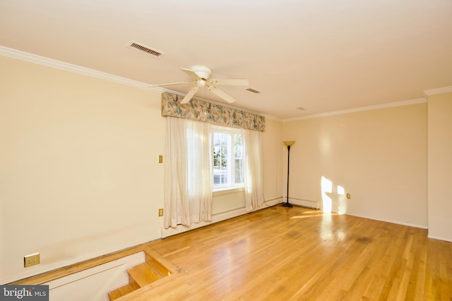 unfurnished room featuring hardwood / wood-style floors, ornamental molding, and ceiling fan