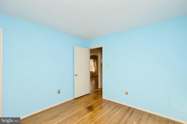 unfurnished room with light hardwood / wood-style floors