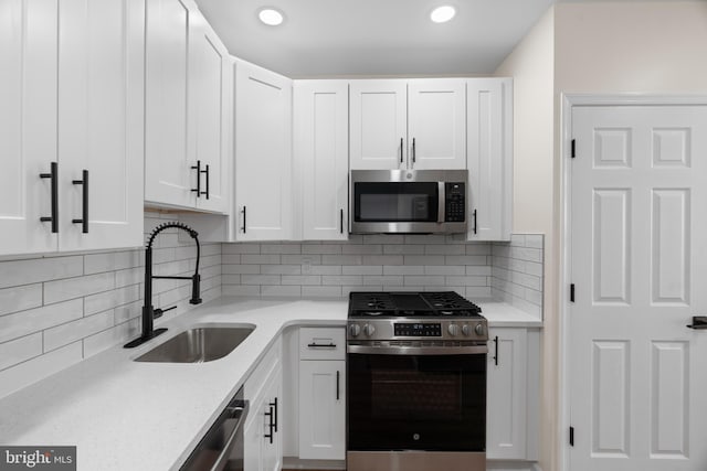 kitchen featuring white cabinetry and stainless steel appliances