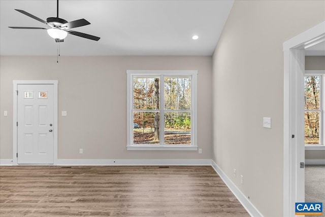 interior space featuring ceiling fan, a wealth of natural light, and light hardwood / wood-style flooring