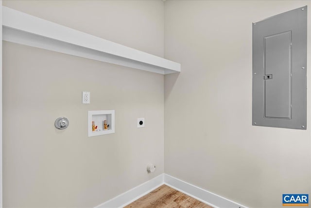 laundry room featuring electric panel, gas dryer hookup, light hardwood / wood-style flooring, washer hookup, and electric dryer hookup