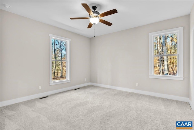 carpeted empty room with ceiling fan