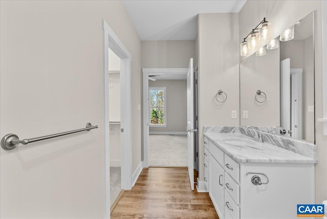 bathroom with vanity and hardwood / wood-style floors