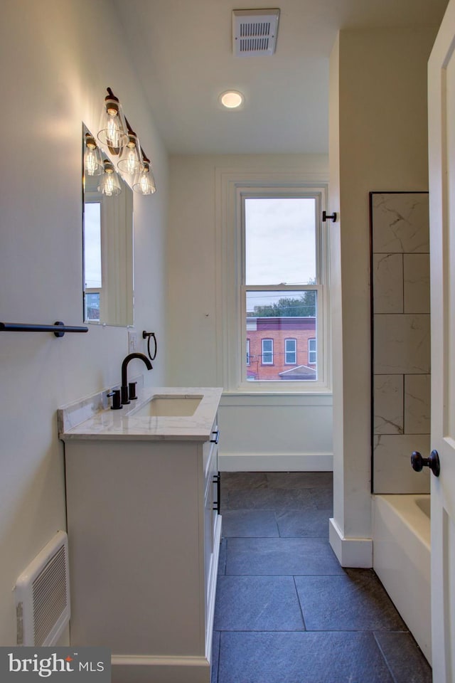 bathroom with vanity and a healthy amount of sunlight