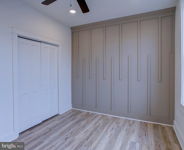 unfurnished bedroom featuring ceiling fan and light hardwood / wood-style flooring