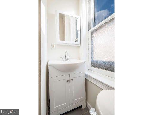 bathroom with toilet and vanity