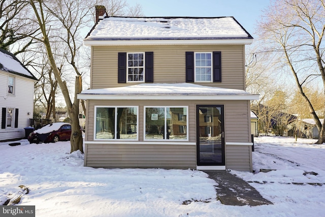 view of front of house with a chimney