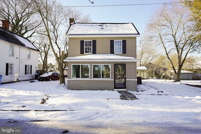 view of front of home with a chimney