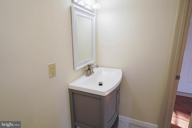 bathroom featuring baseboards and vanity