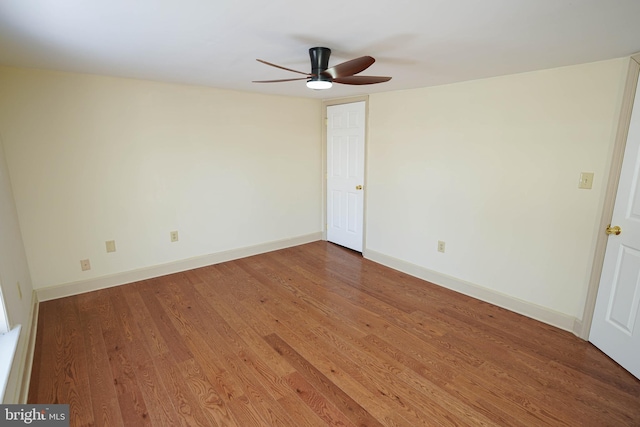 empty room featuring ceiling fan and hardwood / wood-style floors