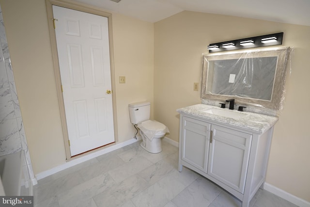 bathroom with toilet, marble finish floor, baseboards, vanity, and vaulted ceiling