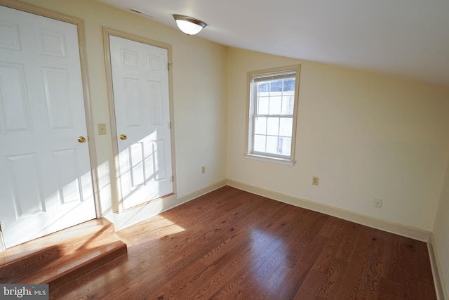 bonus room with hardwood / wood-style floors