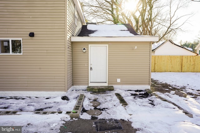 view of snow covered property entrance