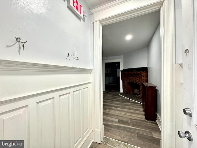 corridor featuring dark hardwood / wood-style flooring