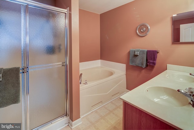 bathroom with separate shower and tub and vanity