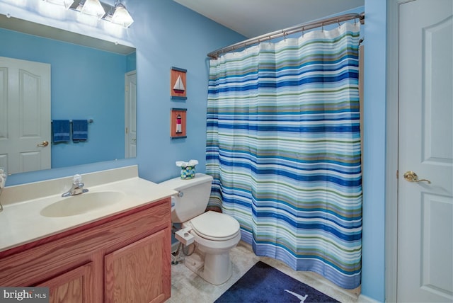 bathroom with vanity, toilet, and a shower with curtain