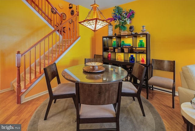 dining space featuring hardwood / wood-style flooring