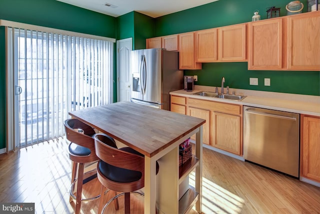 kitchen with sink, light brown cabinetry, and appliances with stainless steel finishes