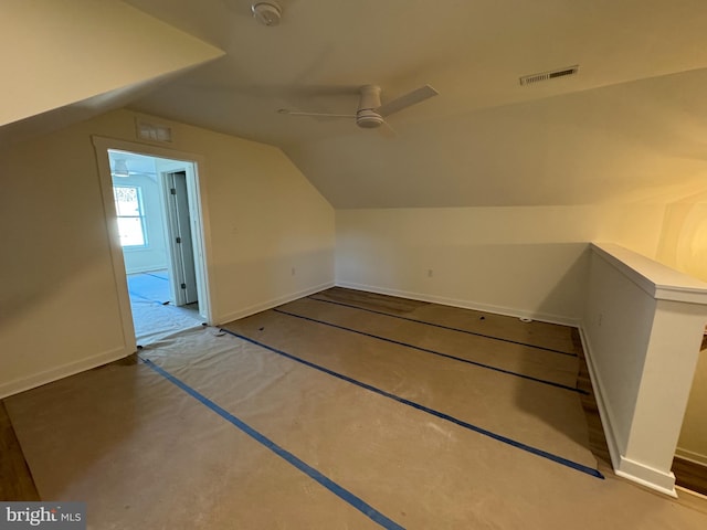 additional living space featuring lofted ceiling and ceiling fan