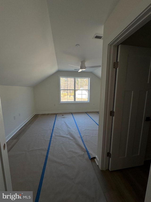 bonus room featuring lofted ceiling and ceiling fan