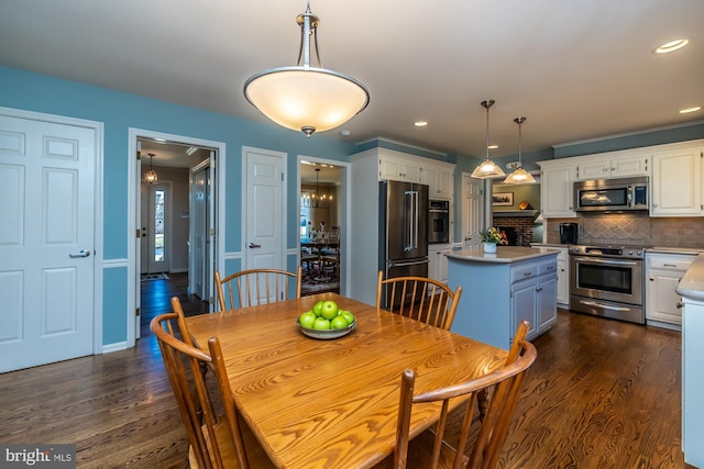 dining room with dark hardwood / wood-style flooring