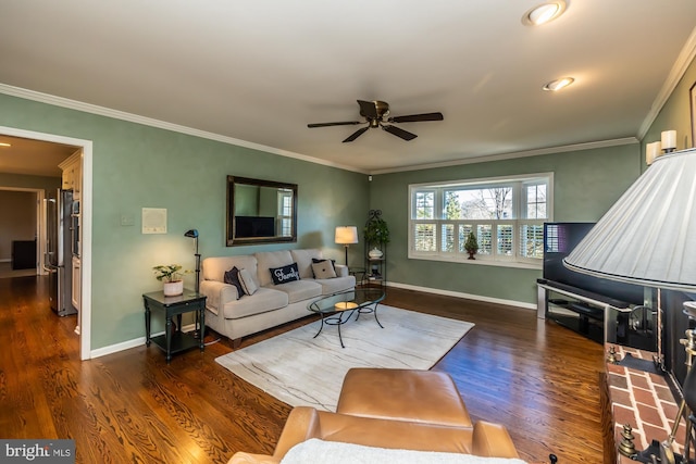 living room featuring crown molding, ceiling fan, and dark hardwood / wood-style floors