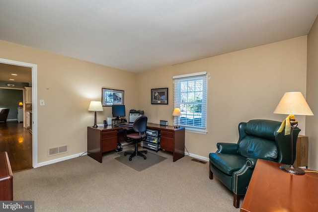 home office with carpet flooring