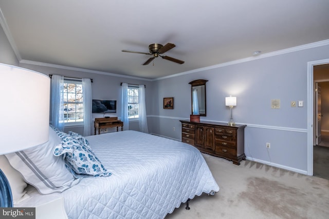 carpeted bedroom featuring ornamental molding and ceiling fan