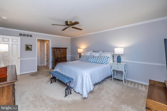 carpeted bedroom with ornamental molding and ceiling fan