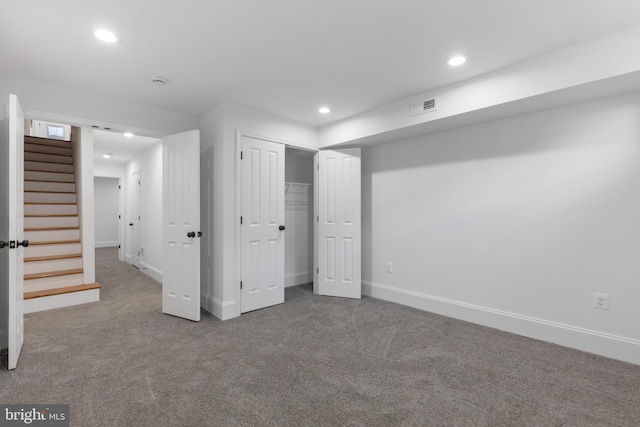 unfurnished bedroom featuring a closet and carpet flooring