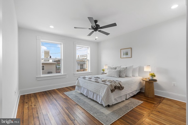 bedroom featuring ceiling fan and wood-type flooring