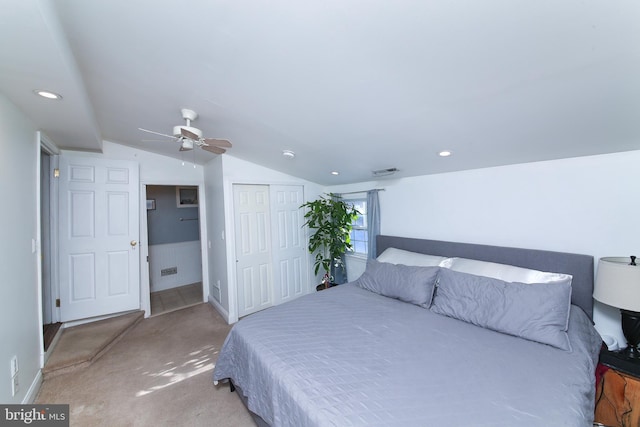 bedroom featuring ceiling fan, carpet, lofted ceiling, and a closet