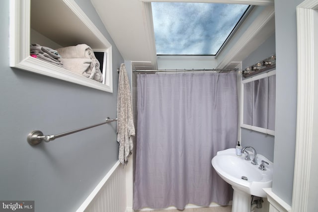 bathroom with sink and a shower with curtain