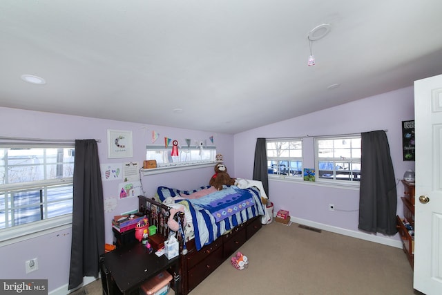 bedroom featuring carpet flooring and vaulted ceiling