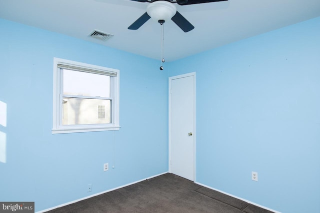 carpeted empty room with ceiling fan