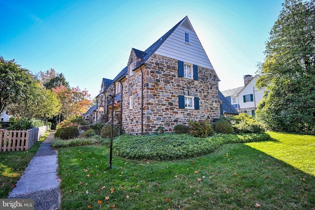 view of property exterior with a yard