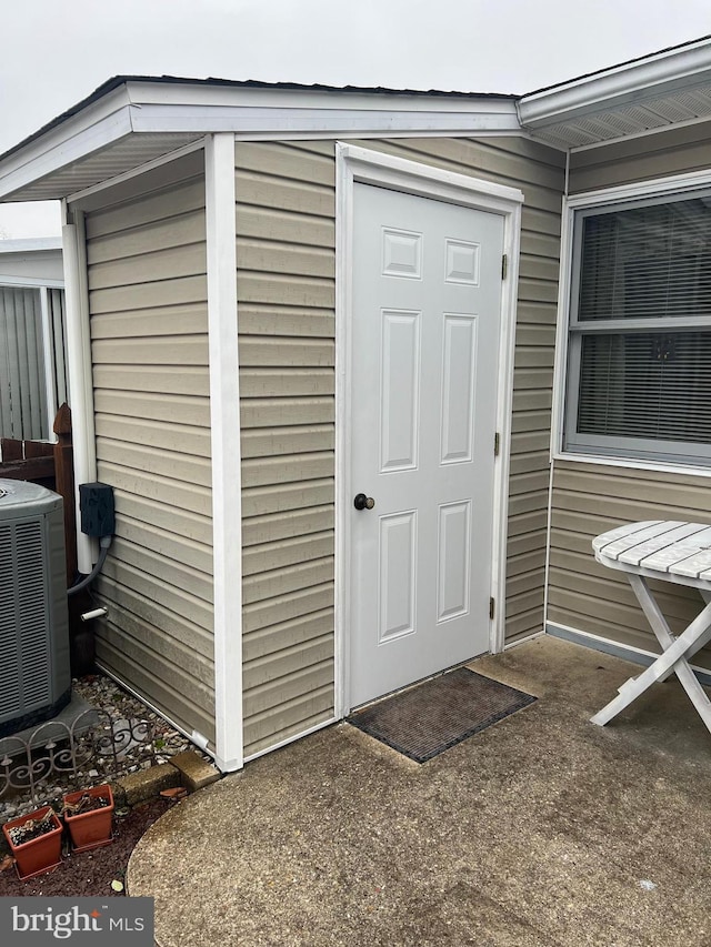 view of outbuilding with cooling unit