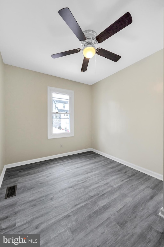 empty room featuring dark hardwood / wood-style floors