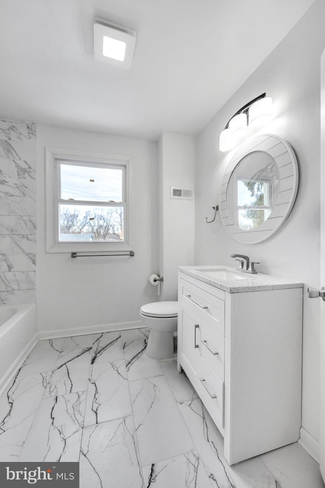 bathroom featuring vanity and toilet