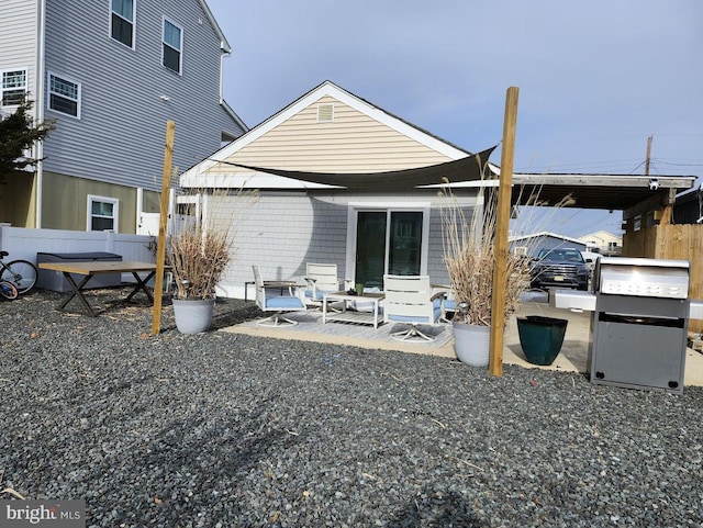 back of house featuring a patio