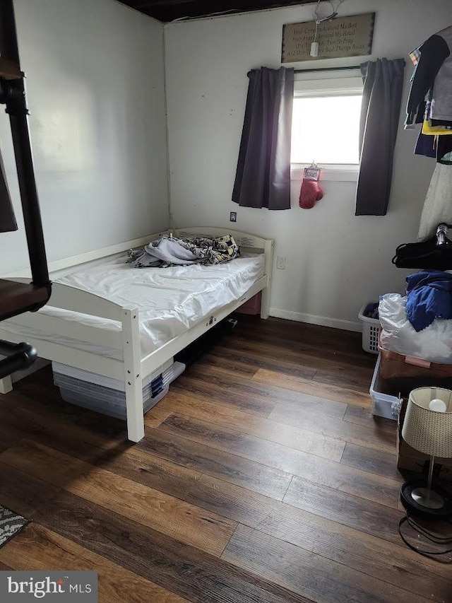 bedroom featuring dark wood-type flooring