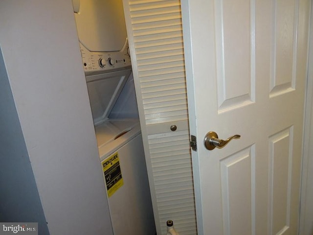 laundry room featuring stacked washing maching and dryer