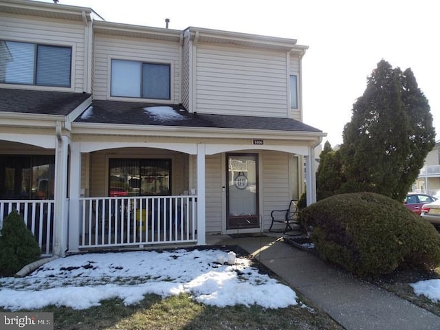 townhome / multi-family property featuring a porch